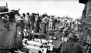 Crewmen wheel bombs to aircraft during the Marshall raids.